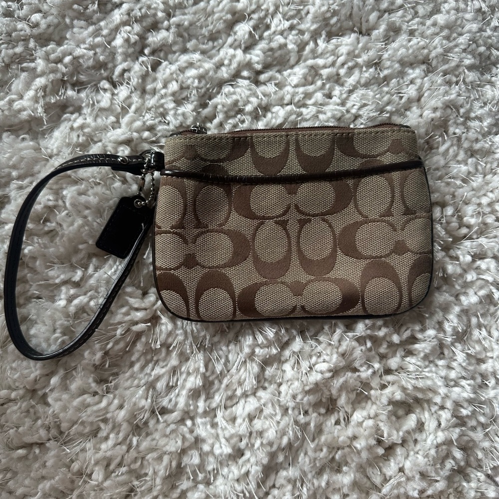 EUC Coach Signature Wristlet Brown w/ purple inside